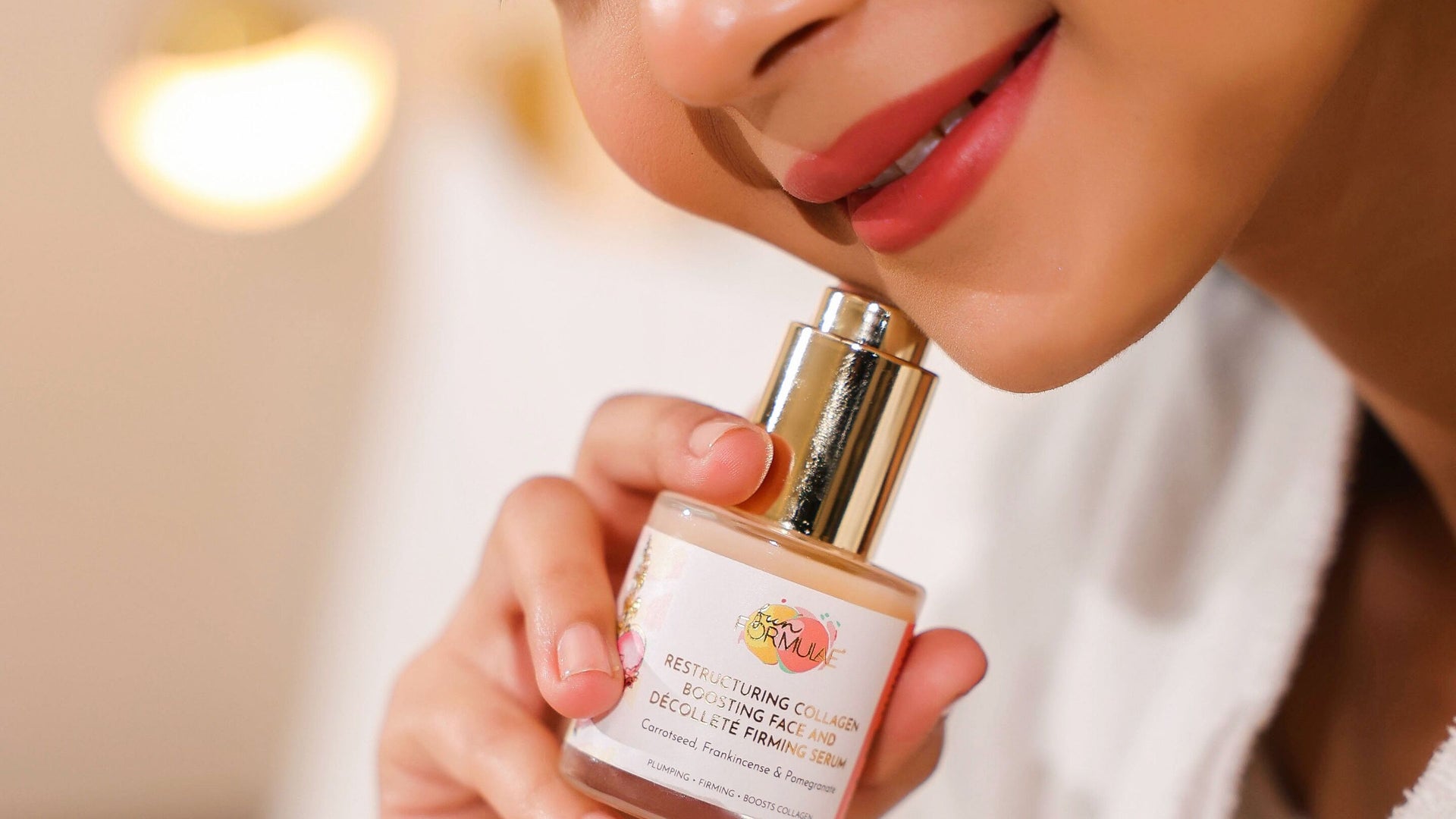 Woman holding Fun Formulae Restructuring Collagen Boosting Face and Décolleté Firming Serum